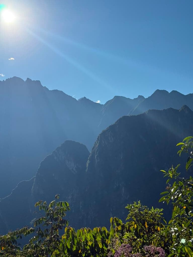 Morning sun flaring over the ridgelines of the Andes